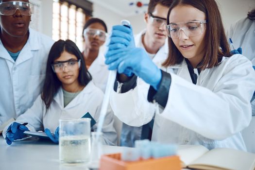 Science research, students and scientist lab for medical innovation, education or knowledge of a group together for learning and analytics . Men and women with scientific chemical for healthcare cure.