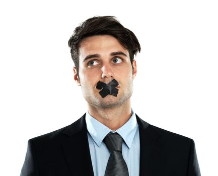 Business man, tape on lips and corporate silence for secret, privacy and confidential information in studio. Person with mouth covered for censored, scared and hush isolated on a white background