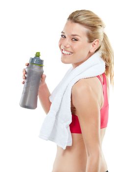 Be Good To Yourself. Studio shot of an athletic young woman holding a water bottle.