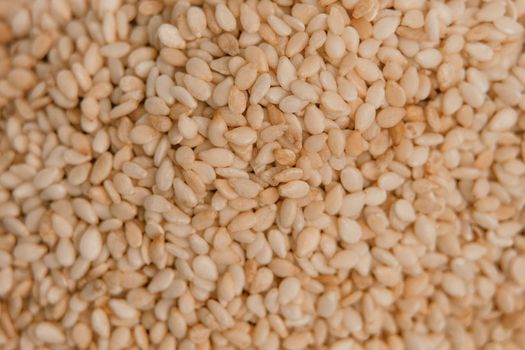 sesame seeds. Pile of white sesame seeds as background, top view