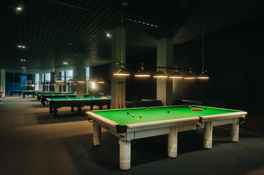 placing snooker balls on a green billiard table