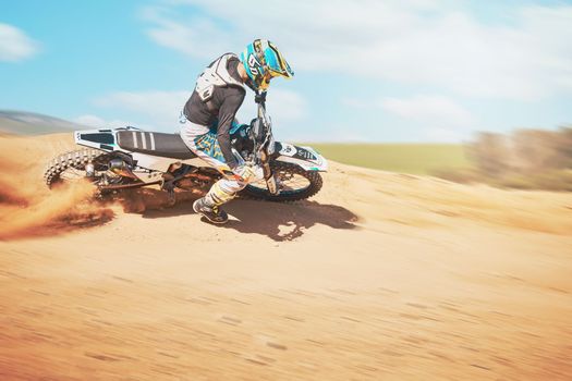 Motorcross, offroad trail and sports for freedom, action or fearless driving. Driver, cycling man and power on dirt track, motorcycle competition and motorbike performance on sand adventure course