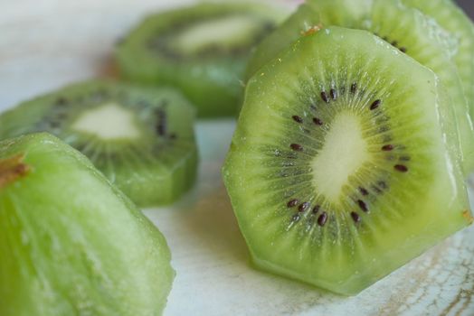 Ripe half kiwi fruit on a plate