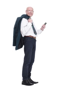man with a jacket over his shoulder reading a message on his smartphone