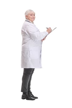 Profile side view portrait of mature doctor writing recommending filling medical form