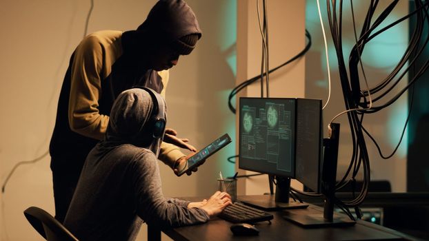 Woman hacker using her knowledge of computer systems