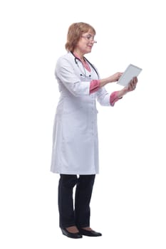 Happy doctor in lab coat and glasses using tablet pc