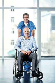 Ive got only his best interests at heart. Portrait of a male nurse caring for a senior patient in a wheelchair.