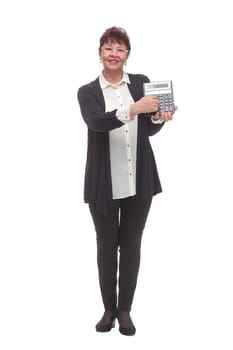 Mature woman holds calculator on a white background