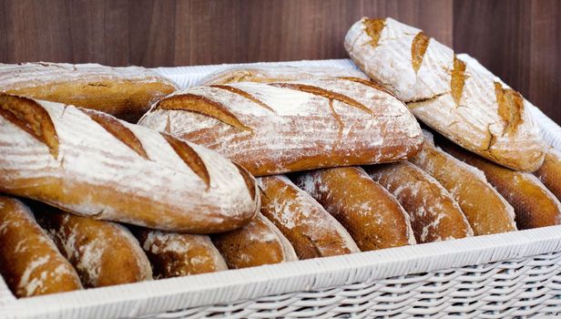 Freshly-baked goodness. Loaves of delicious bread packed in a basket.