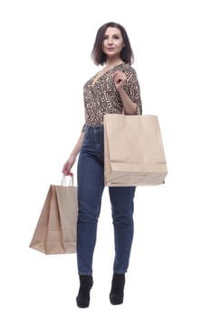 in full growth.attractive young woman with shopping bags.