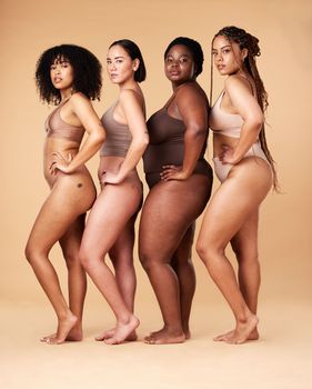 Body positivity, skin and portrait of women group together for inclusion, beauty and power. Aesthetic model friends on beige background with underwear cellulite, pride and motivation for self love