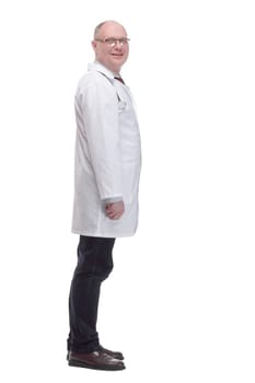 qualified mature doctor in a white coat .