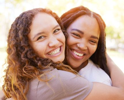 Young women and friends hug portrait for togetherness at park for bonding, wellness and happiness. Gen z, youth and natural black people with happy smile and embrace on summer hangout in nature.