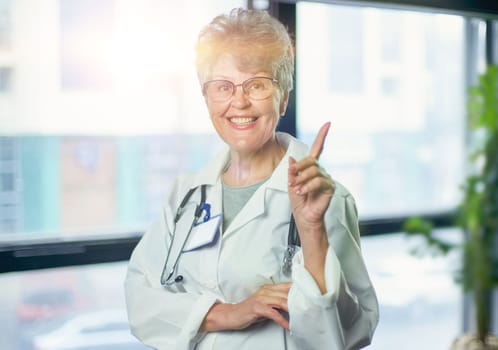 Senior female doctor smiling in hospital