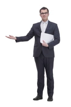 Business man in glasses and formalwear is readin a document while standing against a white background
