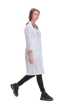 female doctor walking towards the camera smiling isolated