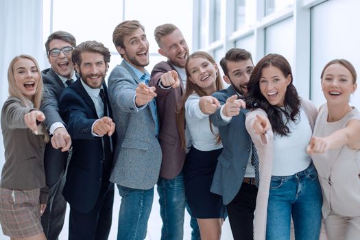 group of successful young people pointing at you
