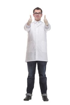 Man with serious face in laboratory coat putting on gloves. Medicine and professional skills concept