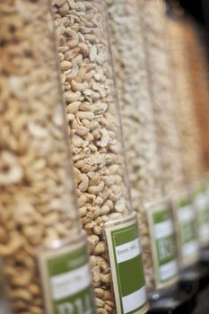 Food, grocery and shopping with nuts in supermarket for health, nutrition and retail offer. Choice, storage and vegan with grain products in zero waste packaging store for wellness, vegan and organic