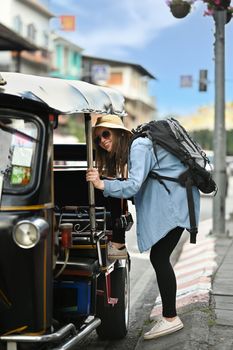 Caucasian female tourist with backpack on holiday vacation trip in Thailand. Travel Lifestyle vacations concept