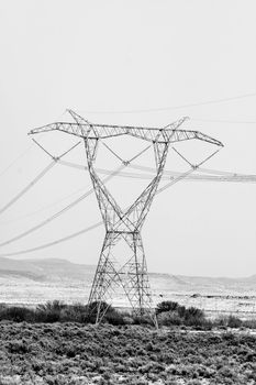 Delta type pylon on a power transmission line. Monochrome