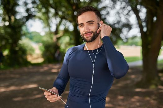Find your rhythm. Cropped portrait of a handsome young male runner listening to music during his workout.