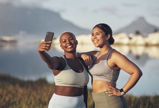 Few things look better than that post-workout selfie. two women taking a selfie while out for a run.together.