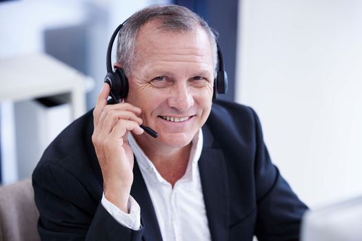 Call center, portrait and businessman smile for telemarketing, virtual communication or digital software support in information technology. Contact us, crm and corporate manager, consultant or agent.