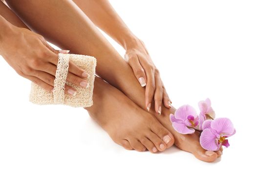 Pedicure, scrub and woman with skincare, feet and natural beauty for female isolated on white studio background. Lady, flower and foot with cosmetics, cleaning and luxury spa treatment for grooming.