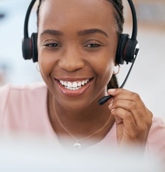 Black woman, happy customer support agent and call center employee with a smile working at online telemarketing business. Crm sales consultant, helping a customer and talking to contact us faq client.