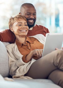 Black couple, relax and smile with tablet for online entertainment together on the living room sofa at home. Happy man and woman relaxing in happiness for internet, connection and streaming on couch
