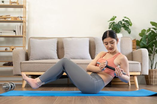Young woman doing health exercises at home