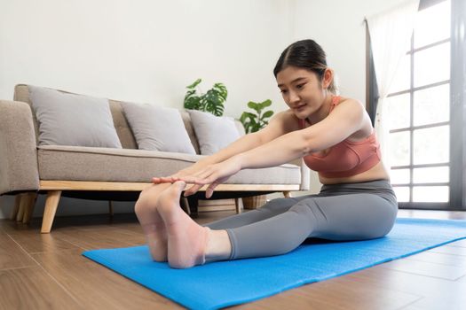 Young woman doing health exercises at home