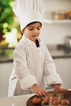Chef at work. a young boy baking in the kitchen.