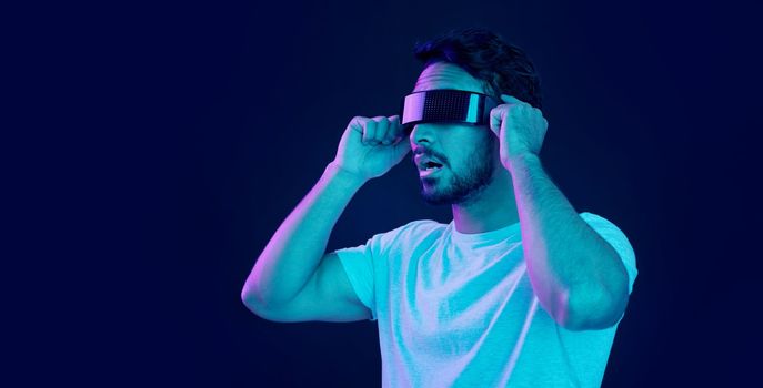 Man with vr headset, gamer and digital transformation for metaverse experience in technology. Person streaming augmented reality simulation, futuristic gaming and studio with dark background