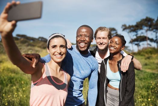 This one will be my profile picture. a group of friends taking a selfie outdoors after their workout