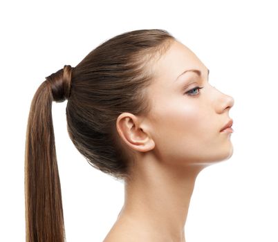 Luxurious hair. Profile of a lovely young woman with luxurious hair.
