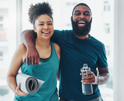 Portrait, yoga and a couple of friends in a gym for fitness while laughing at a joke or being funny together. Happy, excited and joy with yogi black people joking indoor during a wellness workout