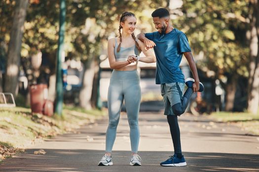 Interracial, couple and stretching for training, wellness and exercise to relax and workout in park. Health, man and woman outdoor for practice, fitness and together for bonding, healthy and talking.