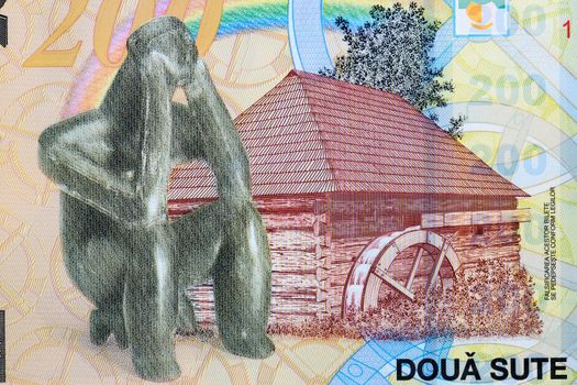 A watermill and The Hamangia Thinker from Romanian money