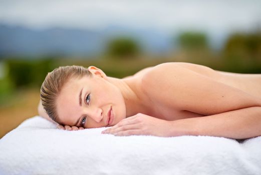 Spending a day at the health spa. Cropped portrait of a young woman lying on a massage table.