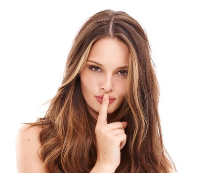 Secret, portrait and woman with finger on lips in studio, isolated white background or privacy. Face, female model and silence on mouth to keep quiet, shush hands and confidential gossip to whisper