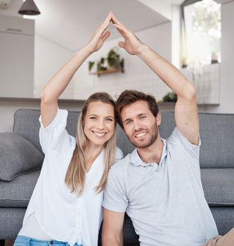 Real estate, security and couple with roof hands for safety, investment and insurance in their house. Property, happy and portrait of a man and woman with smile for future in their new home together