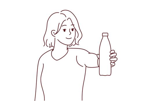 Smiling woman holding bottle of water