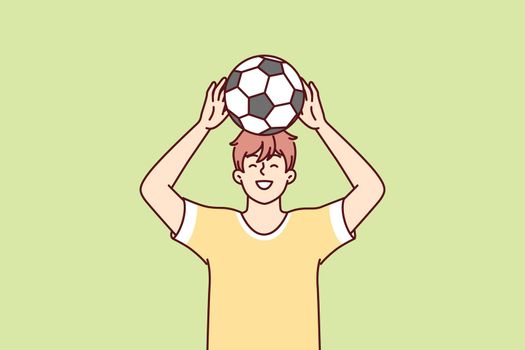 Teenage boy raises ball over head dreams of becoming professional football player. Vector image