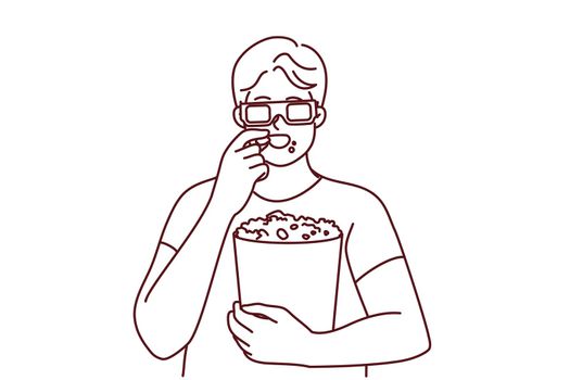 Man in 3D glasses eating popcorn