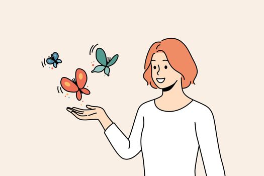 Smiling woman with butterflies