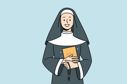 Smiling nun with bible and rosary