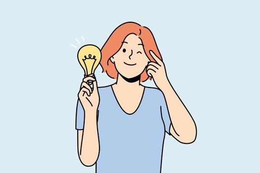 Smiling woman with lightbulb develop business idea